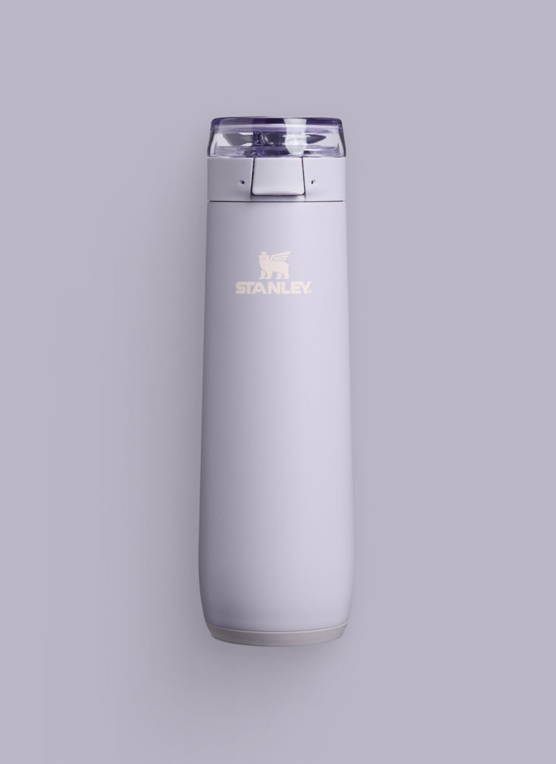 Purple Dust bottle on a lilac background